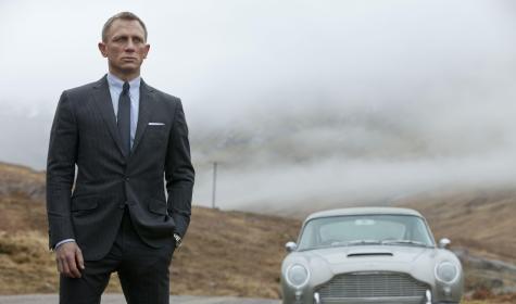 James Bond next to his car