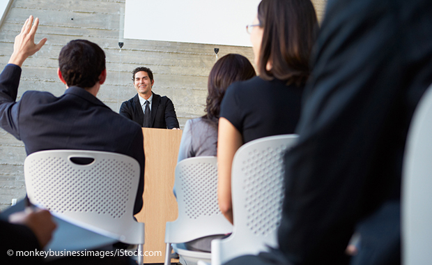 presentation: a person from the audience raises their hand