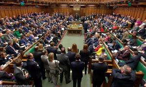 Britain's Prime Minister Theresa May addresses the House of Commons on her government's reaction to the poisoning of former Russian intelligence officer Sergei Skripal and his daughter Yulia in Salisbury, in London,