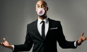 businessman blowing bubblegum