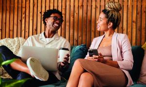 Two business people talking and laughing