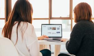 Two women at work with a laptop