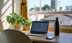 A laptop on a desk at home