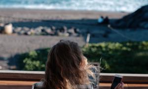 A woman working by the beach