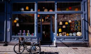 blue storefront with bike parked in front