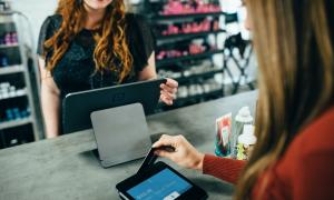 customer paying for goods at a service counter