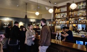 customers enjoying beverages at a bar