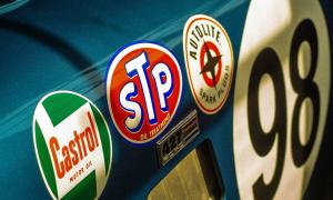 Sponsor stickers on the side of a race car.
