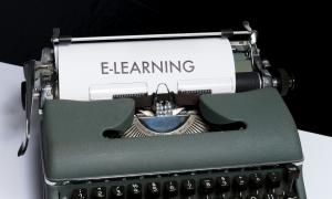 a sheet of paper that says "e-learning" on it coming out of a typewriter