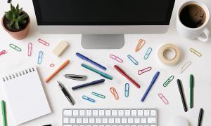 A shot of a messy desk from above