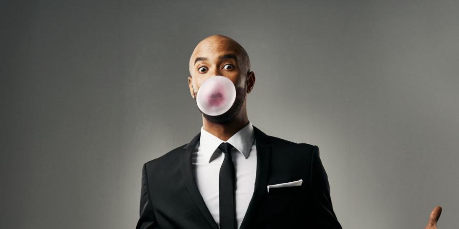 businessman blowing bubblegum