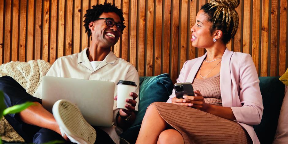 Two business people talking and laughing