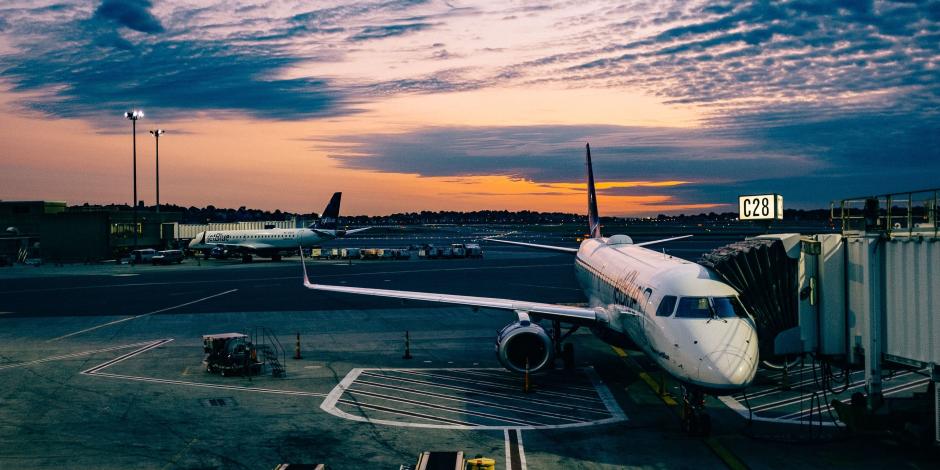 plane parked at gate of an airport