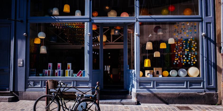 blue storefront with bike parked in front