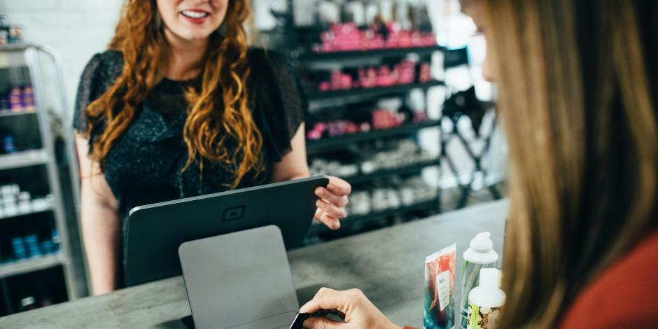 customer paying for goods at a service counter