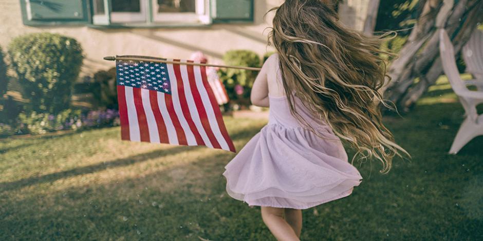 girl running with American flag