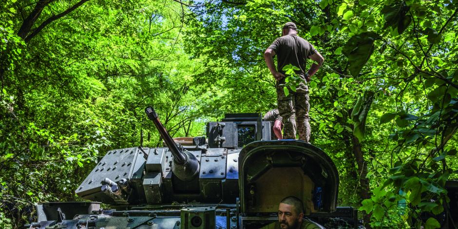 Ukranian soldiers test drive a fighting vehicle