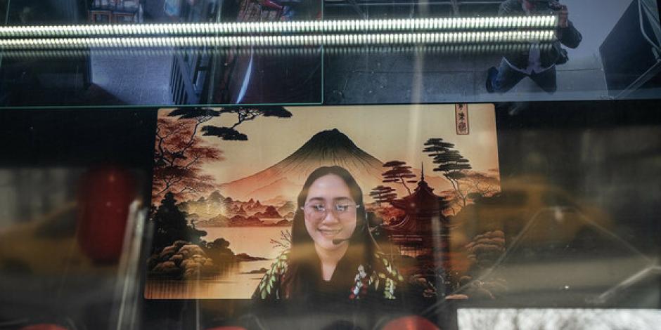 A remote cashier appears on a screen at an outlet of the SanSan Ramen restaurant, in New York, April 4, 2024. A handful of New York City restaurants are experimenting with virtual staff members, who greet customers on a screen via Zoom from the Philippines. 