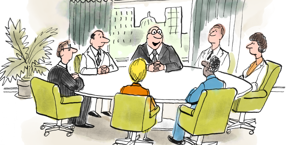 several members of a business team sitting down for a meeting