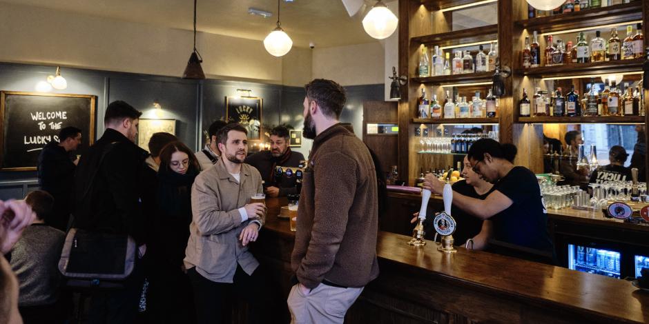 customers enjoying beverages at a bar