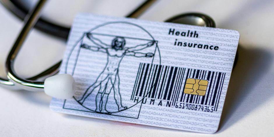 A health insurance card and stethoscope