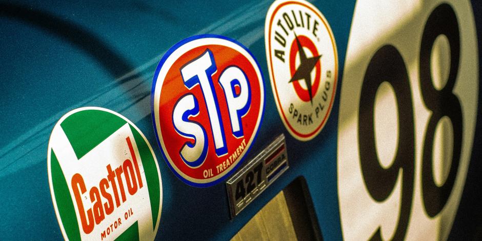 Sponsor stickers on the side of a race car.