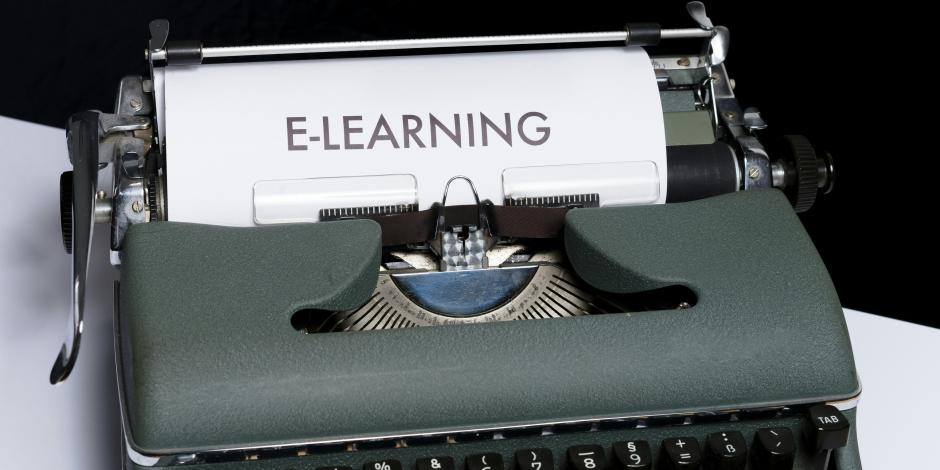 a sheet of paper that says "e-learning" on it coming out of a typewriter