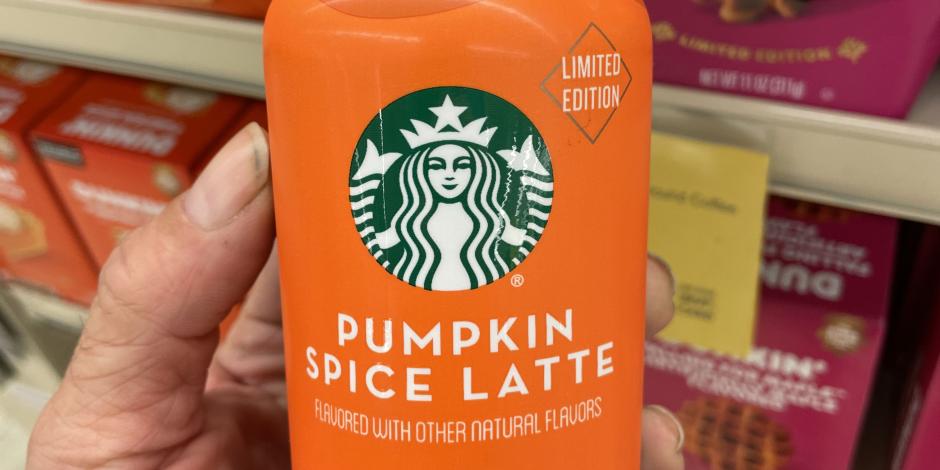 Someone holding a bottle of Starbucks Pumpkin Spice Latte iced espresso