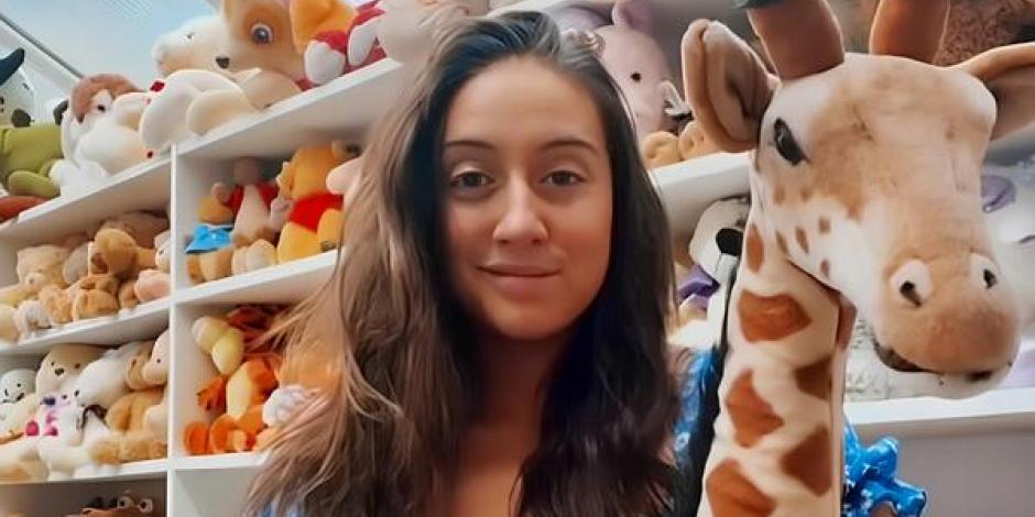 Charlotte Liebling in front of shelves of stuffed toys