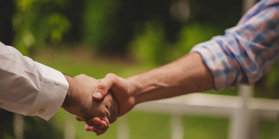 two people shaking hands
