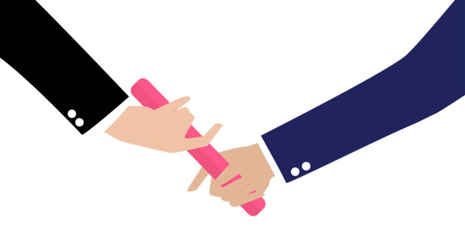 Businessman hand passing the baton in a relay race. Partnership or teamwork concept 