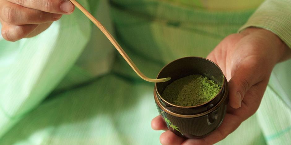 A person presenting matcha at a tea ceremony