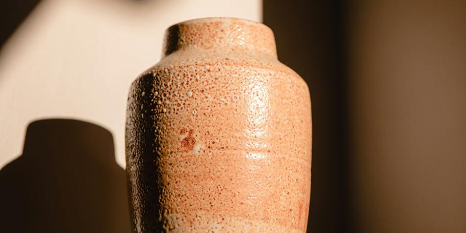 An urn standing in the shadows