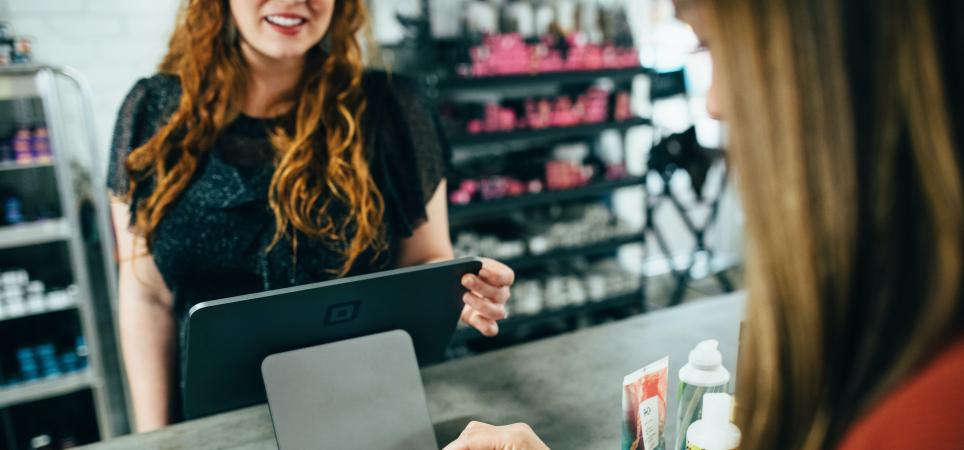customer paying for goods at a service counter