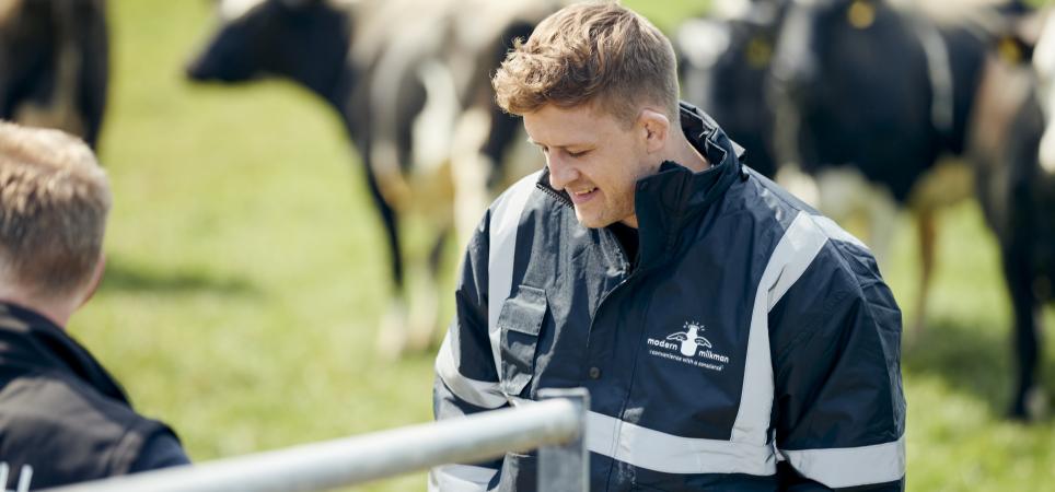 Simon Mellin, The Modern Milkman, surrounded by cows at a farm