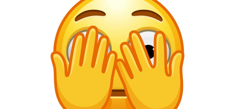 iStock.com emoji face hiding behind hands