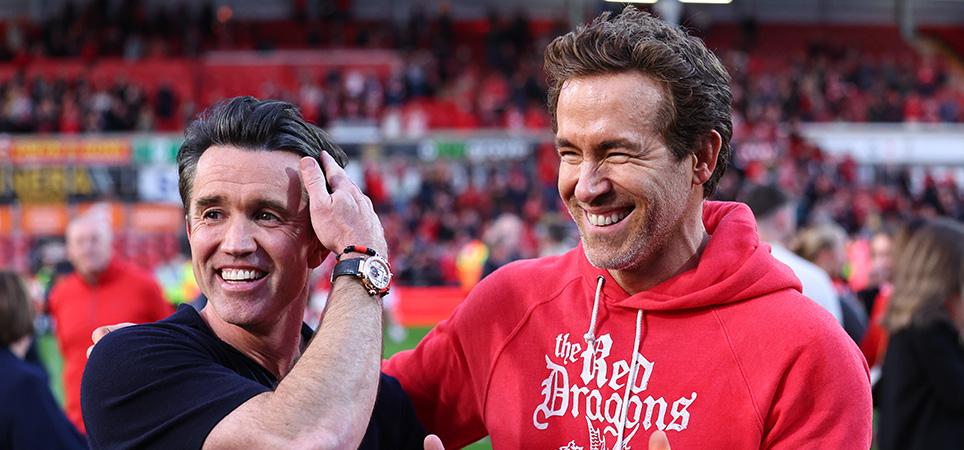Ryan Reynolds and Rob McElhenney co owners of Wrexham with the trophy during the Sky Bet League One match between Wrexham AFC and Charlton Athletic FC at Racecourse Ground on April 26, 2025 in Wrexham, Wales.