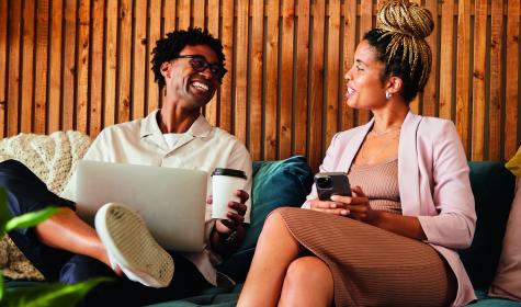 Two business people talking and laughing