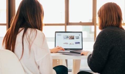 Two women at work with a laptop