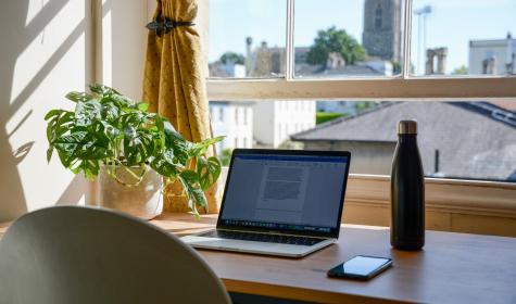 A laptop on a desk at home