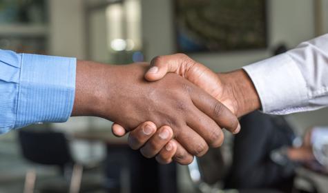 Two businessmen shake hands