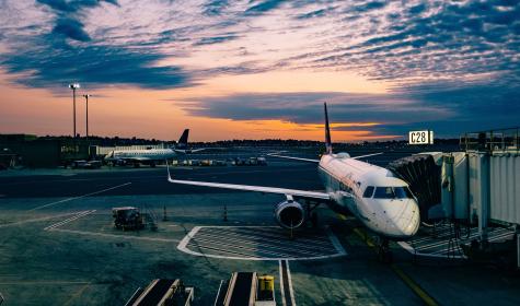 plane parked at gate of an airport