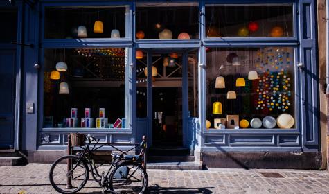 blue storefront with bike parked in front