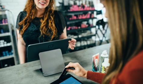 customer paying for goods at a service counter