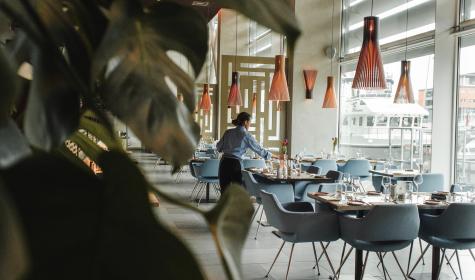 server setting the tables in a restaurant