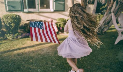 girl running with American flag