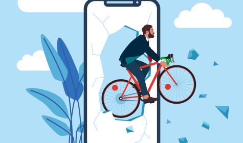 businessman on bike breaking out of a mobile phone screen
