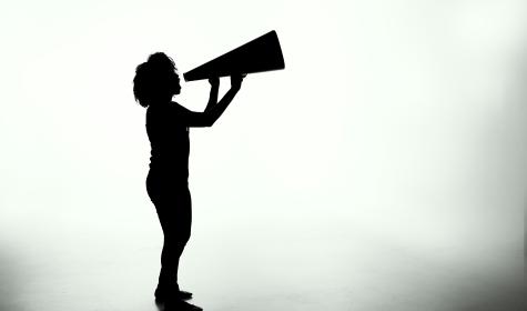 woman shouting into megaphone