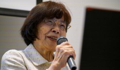 Atomic bomb survivor Teruko Yahata speaks to foreign visitors in Hiroshima