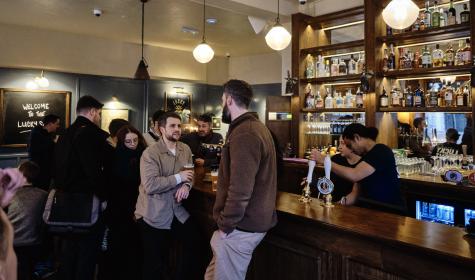 customers enjoying beverages at a bar